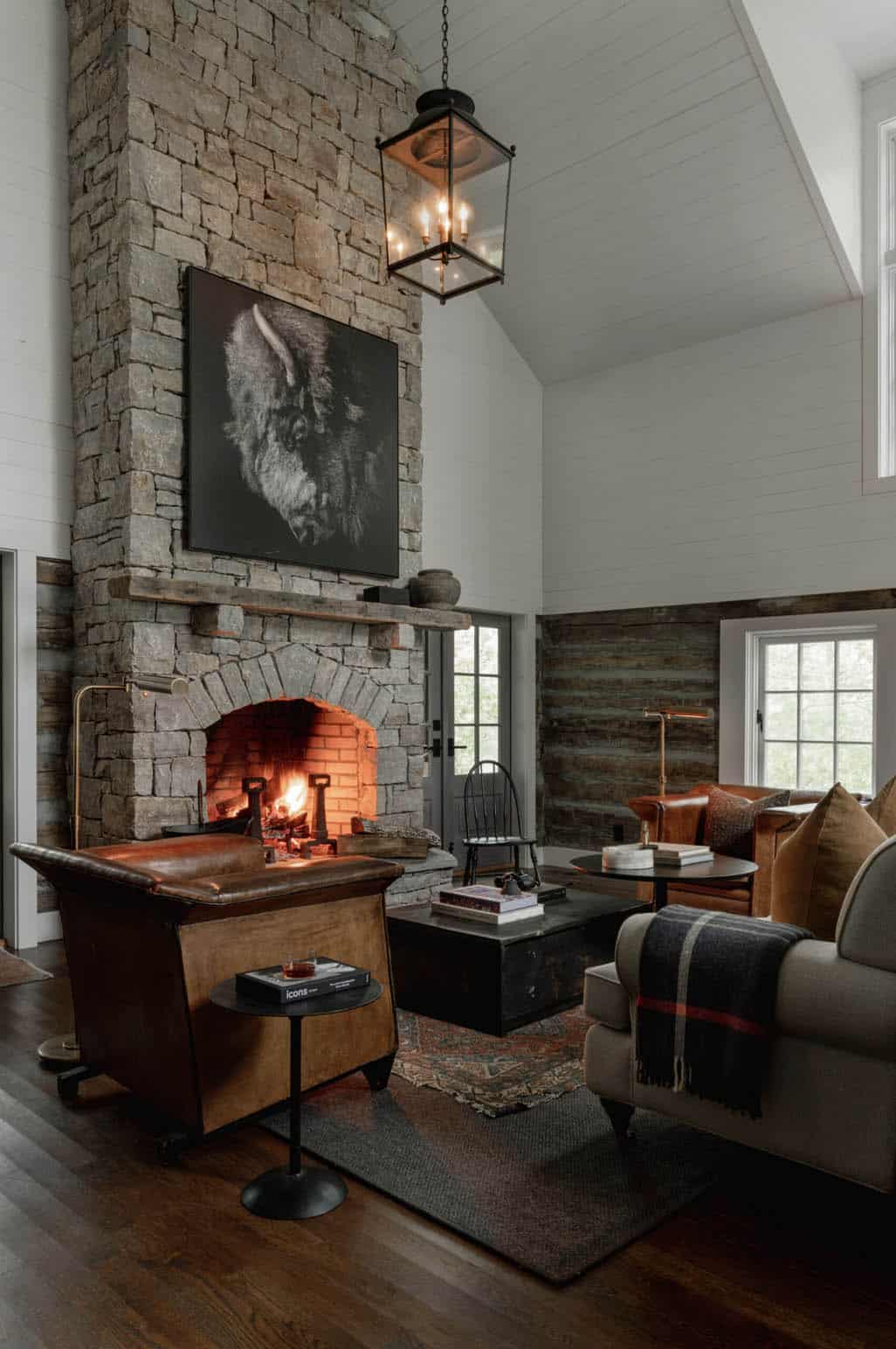 farmhouse style living room with a fireplace