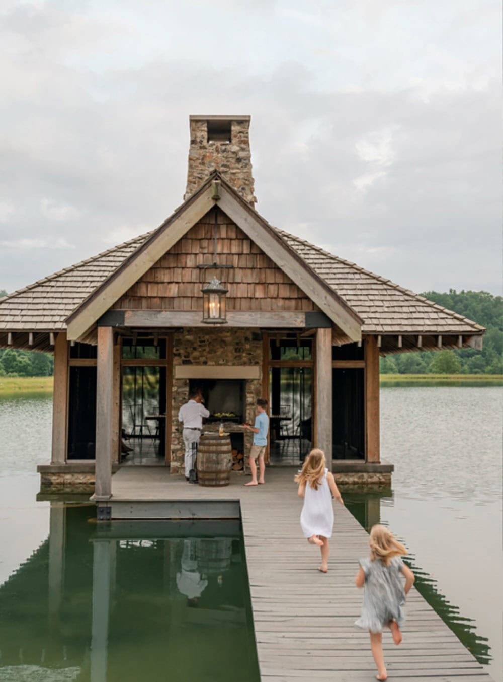 boardwalk over the lake leading to a pavillion