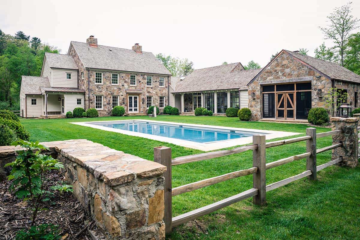 stone farmhouse exterior with a pool