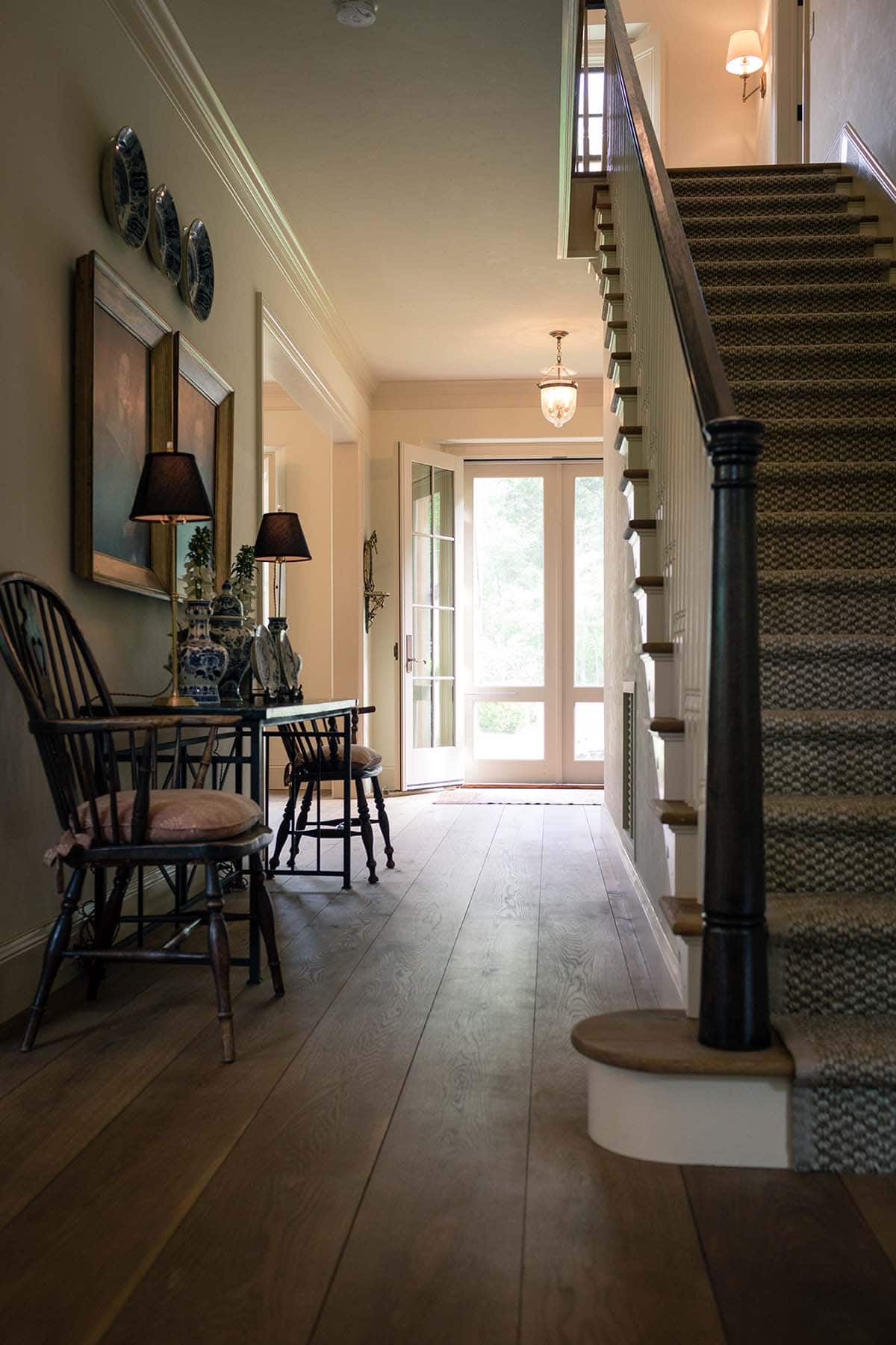 farmhouse style entry with a staircase