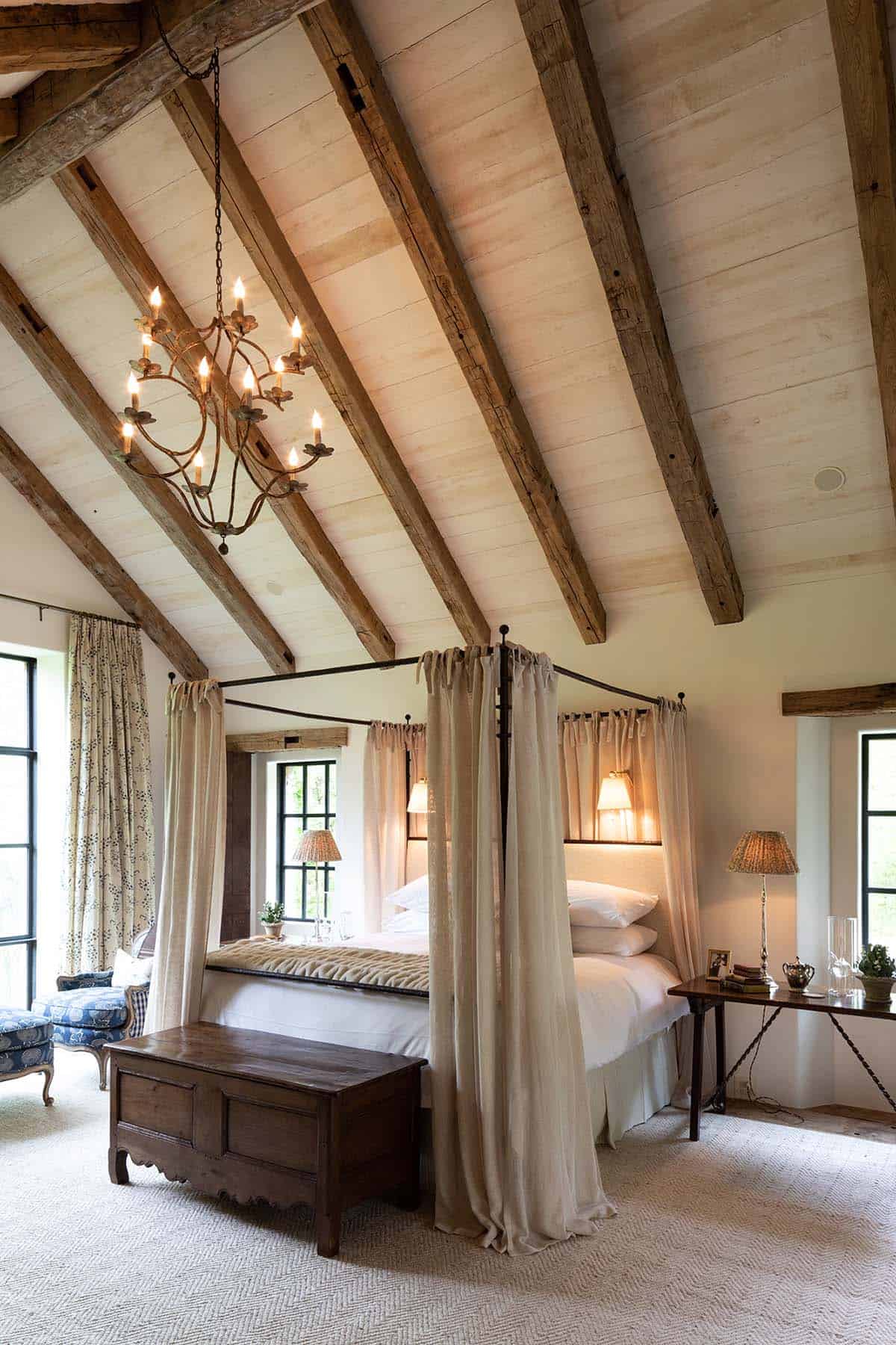 farmhouse style bedroom with a vaulted ceiling
