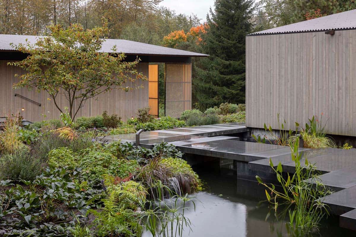 modern home exterior with a water feature