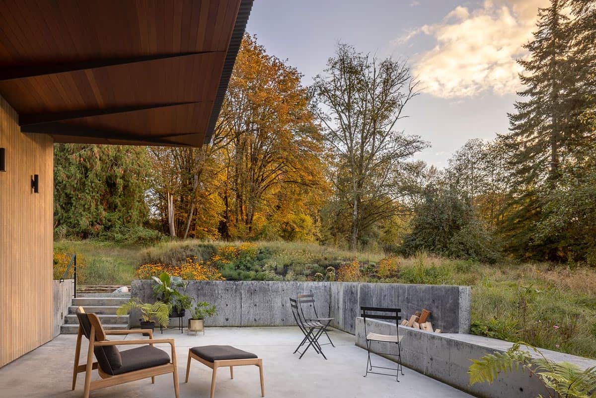 modern home exterior with a patio and lounge chairs
