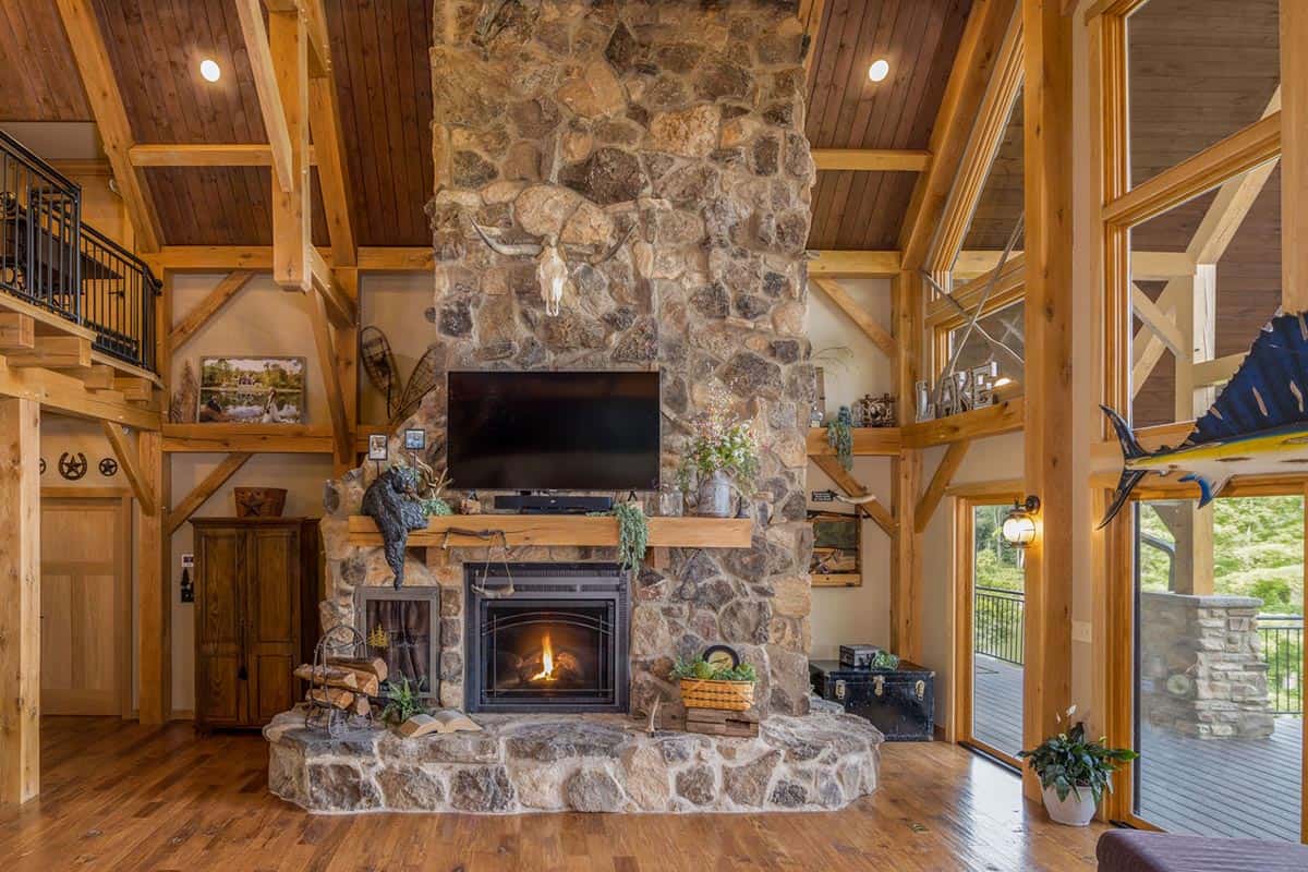 timber living room with a fireplace
