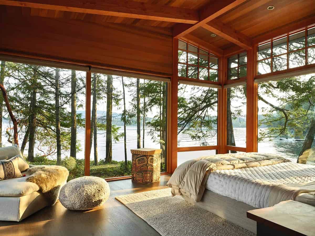 modern rustic bedroom with a view of the water