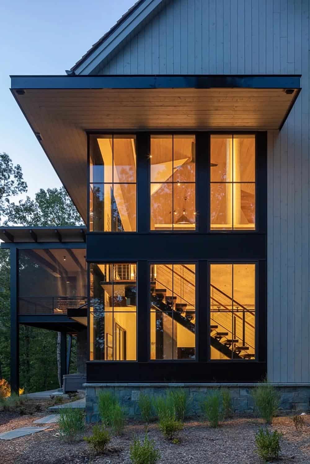 traditional lake house exterior at dusk