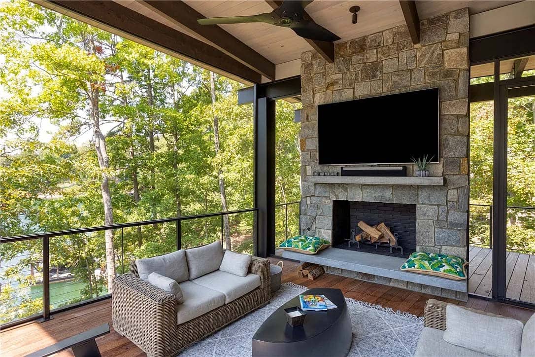 modern covered porch with a fireplace