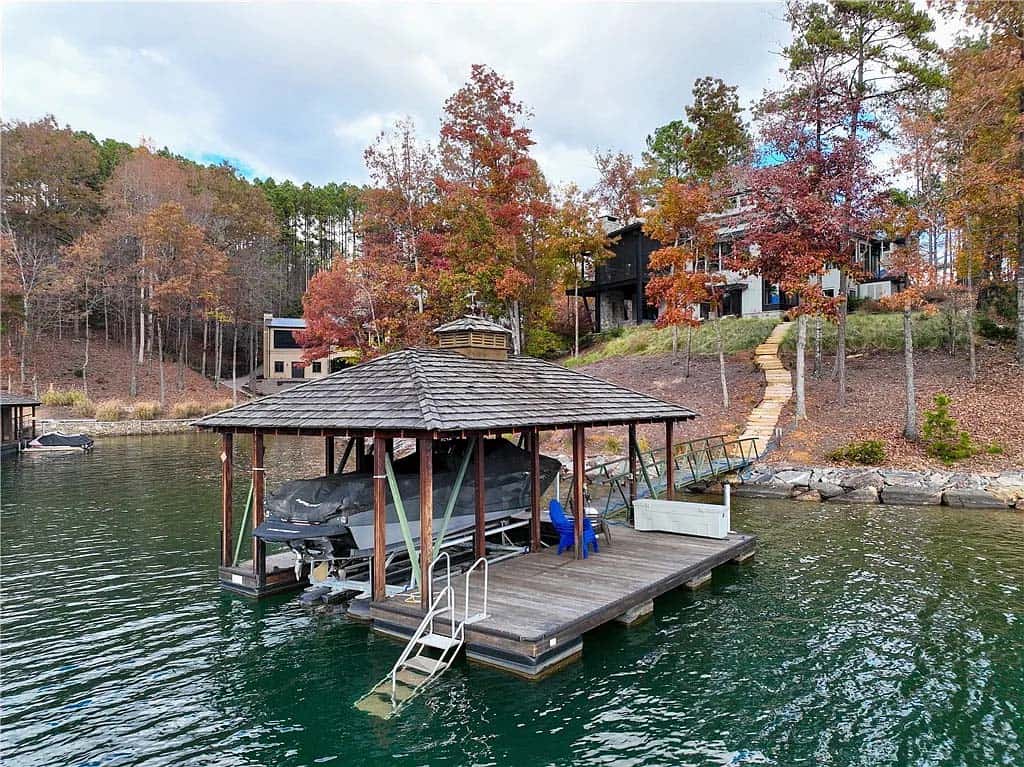 modern lake house exterior boat house with a dock
