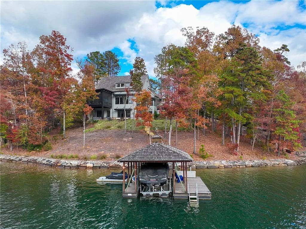 modern lake house exterior boat house with a dock