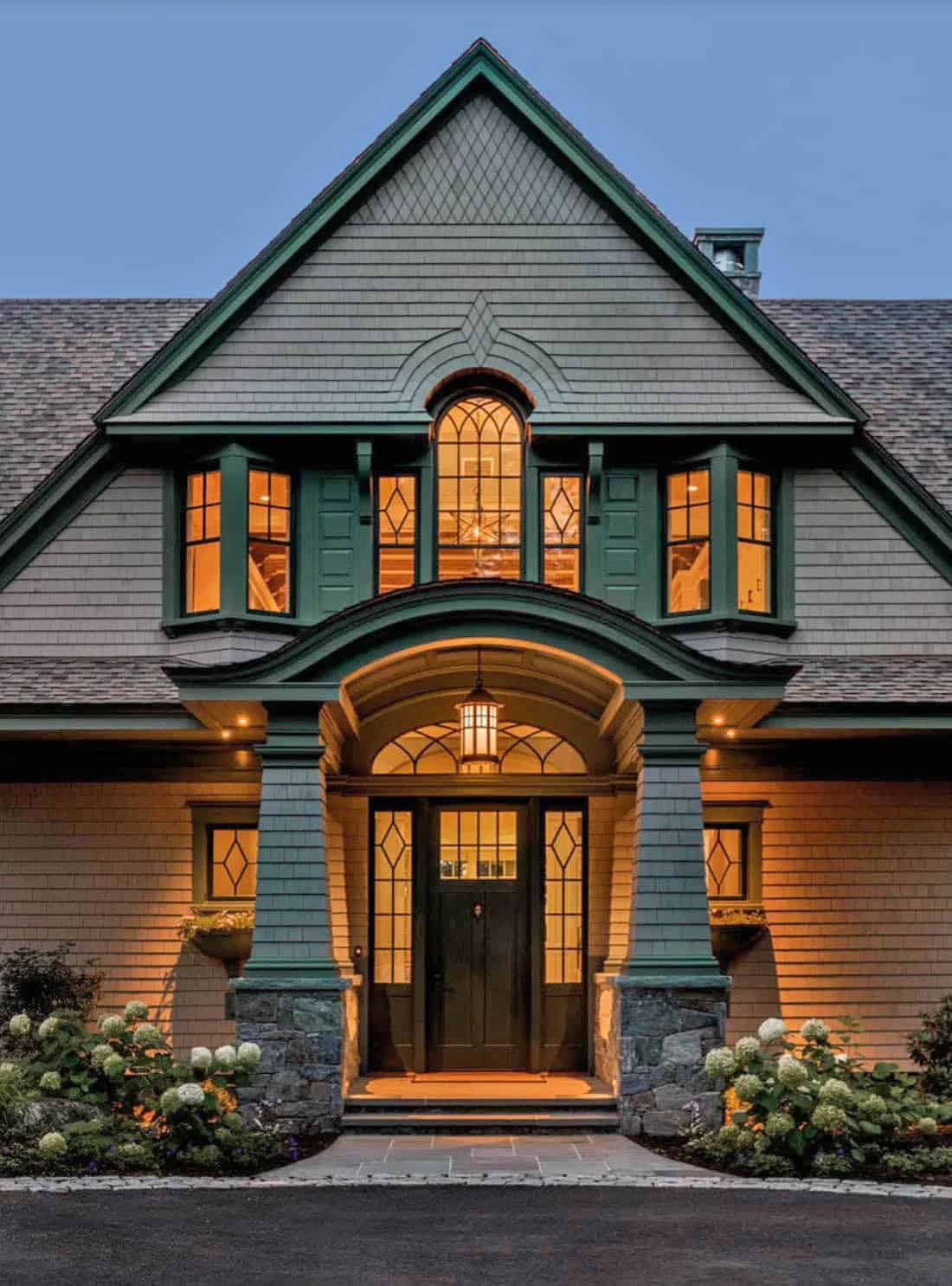 traditional style lake house exterior at dusk