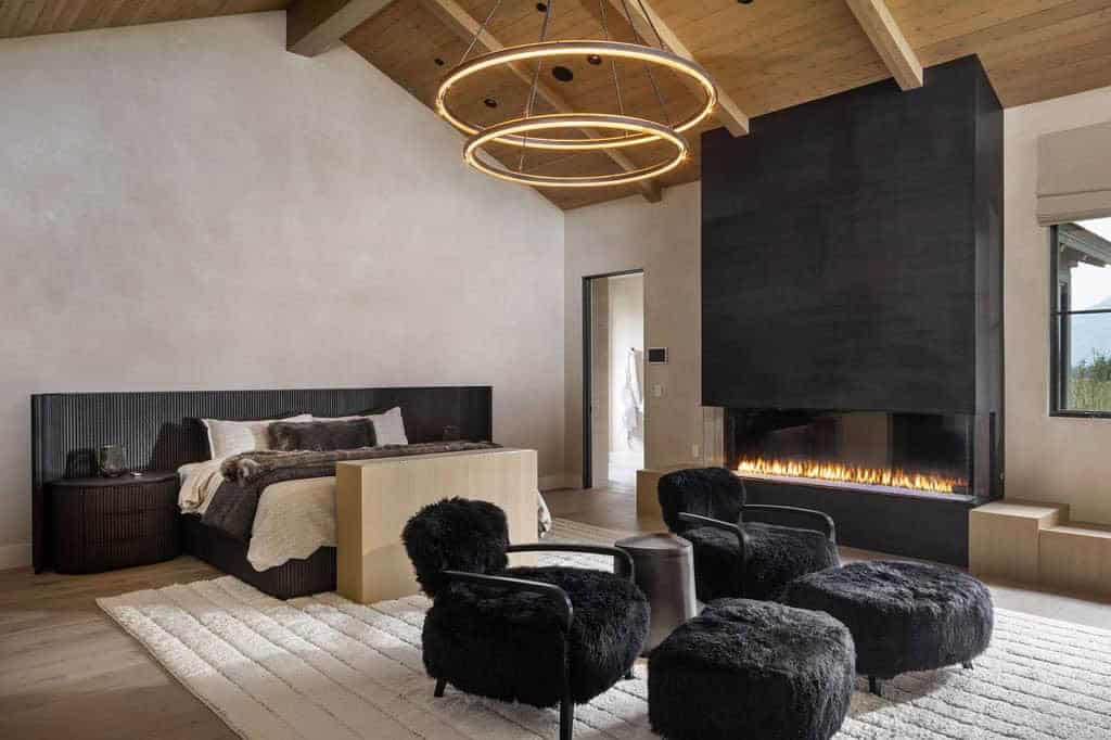 transitional style bedroom with a fireplace