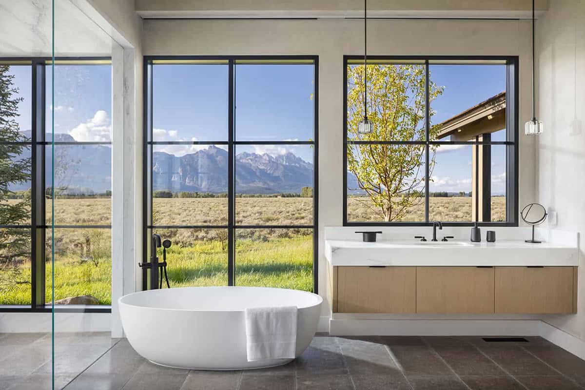 transitional style bathroom with mountain views through a large window