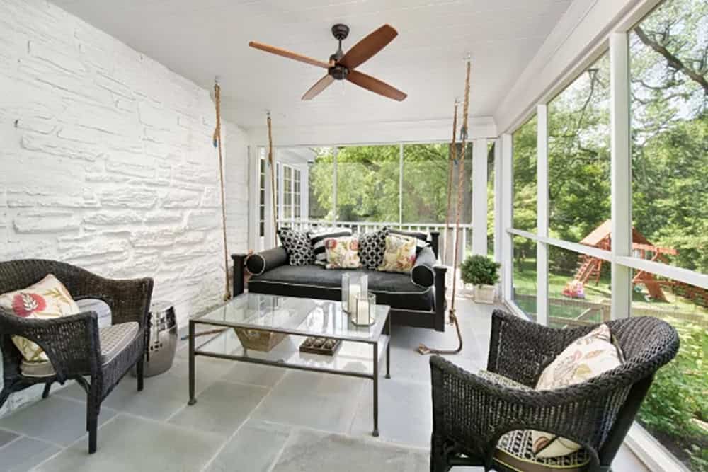transitional style covered patio with outdoor furniture