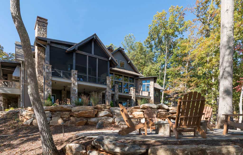 modern rustic lake house exterior backyard view
