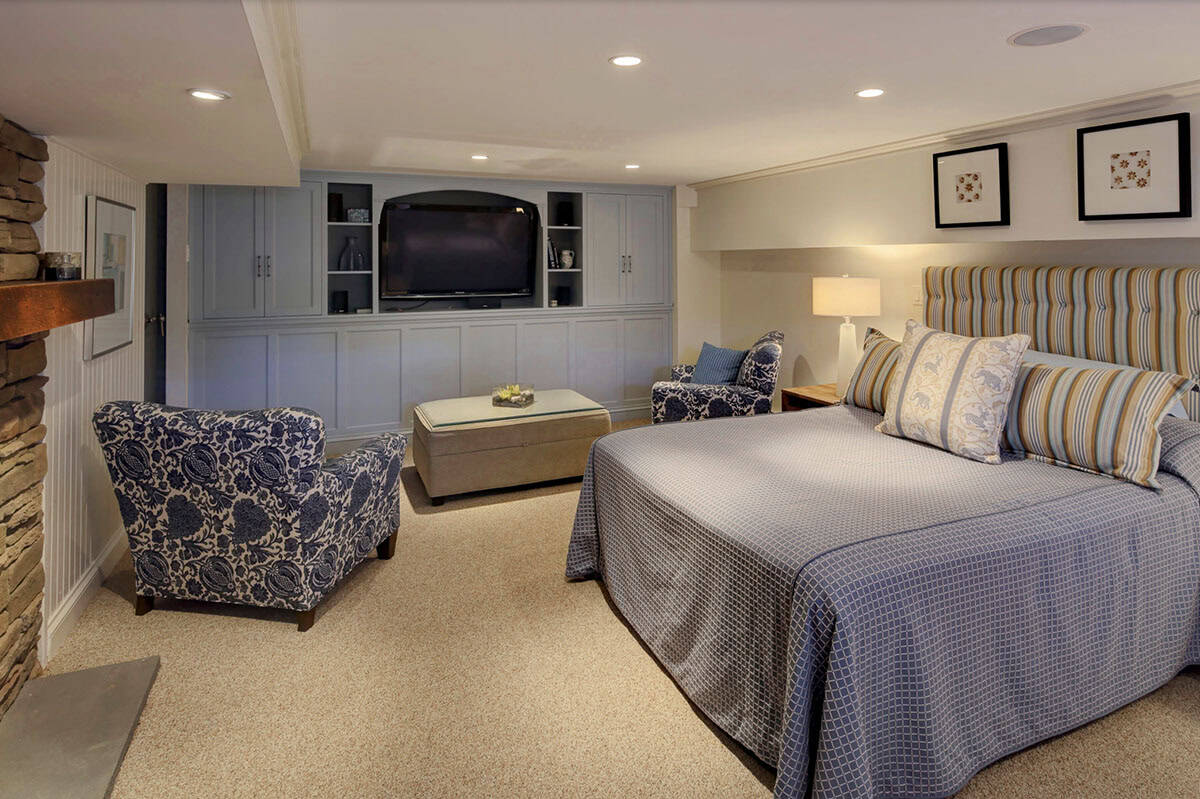 traditional style basement bedroom with a built-in media