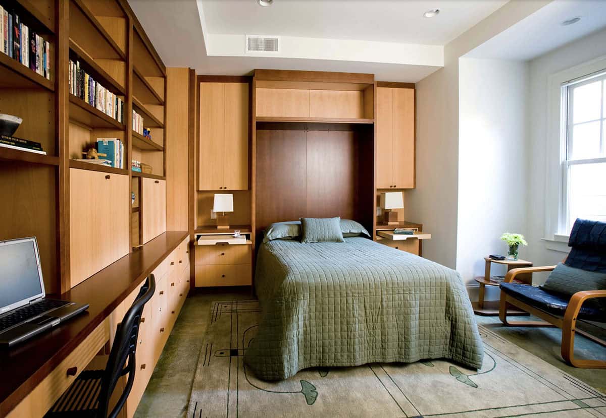 contemporary basement bedroom with built-in storage and murphy bed