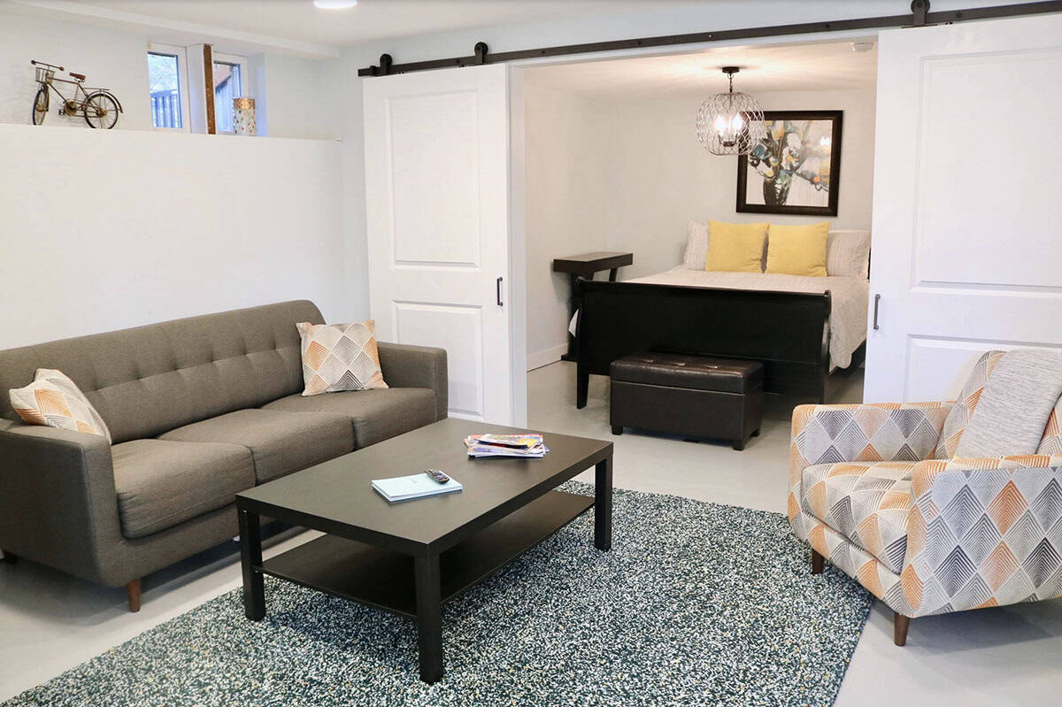 modern basement guest bedroom with sliding barn doors