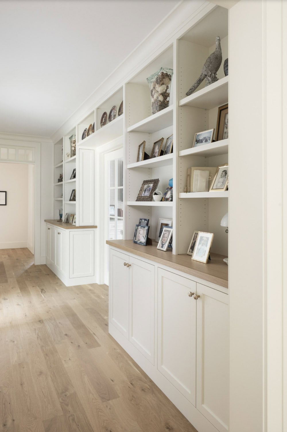 Beach Style Hall with built-in bookshelves