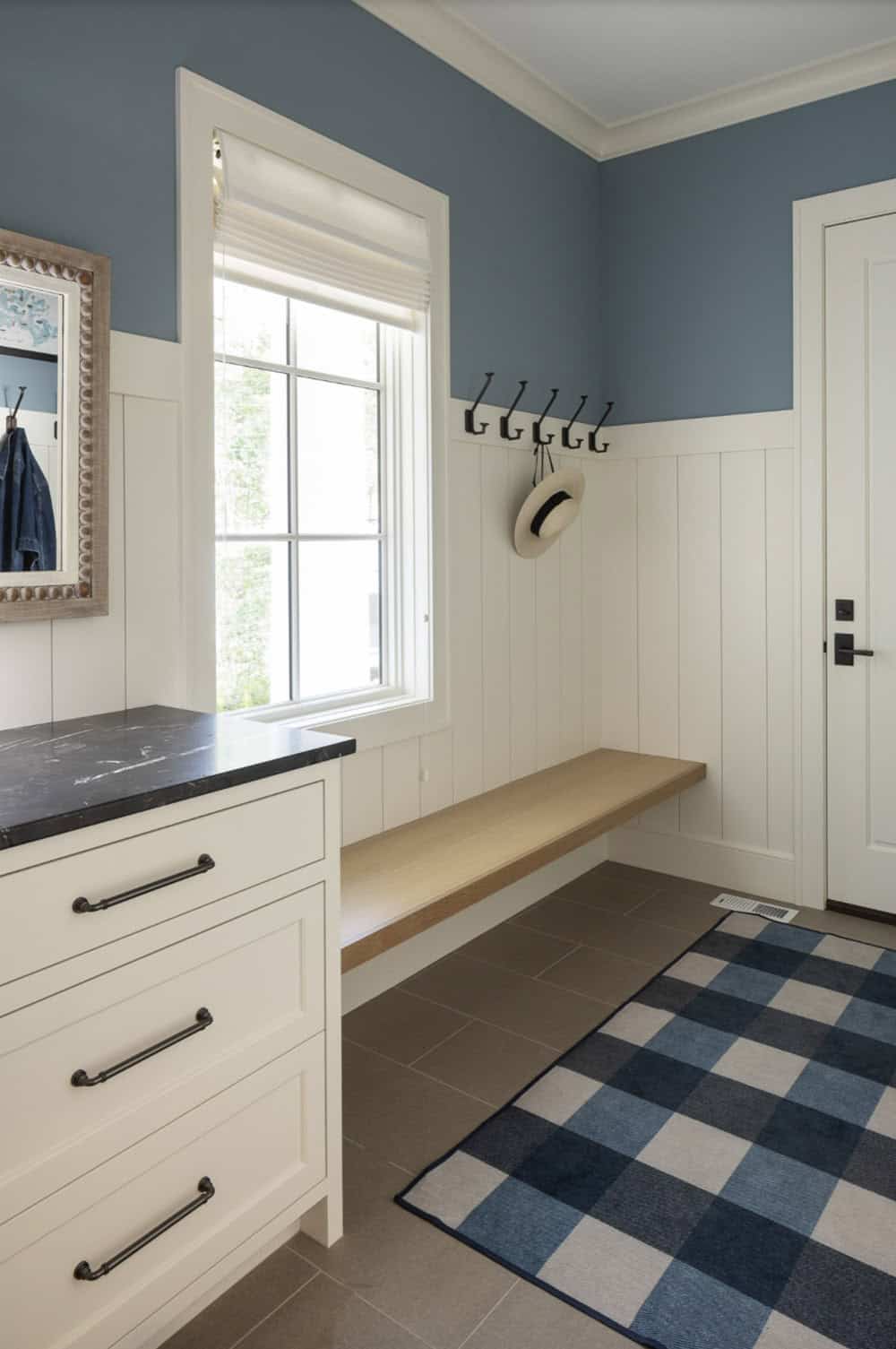 Beach Style Mudroom Entry with a built-in bench