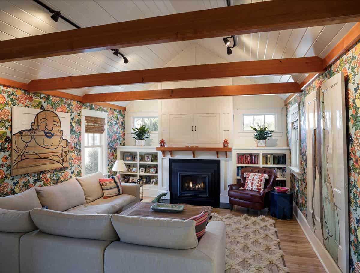 beach style living room with a fireplace