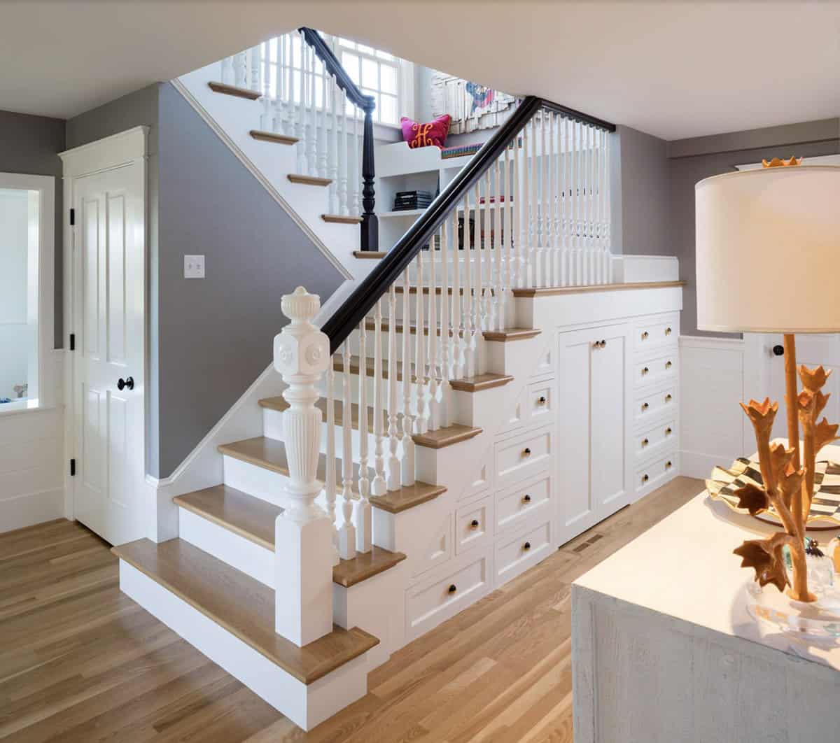 traditional style staircase with built-in drawers