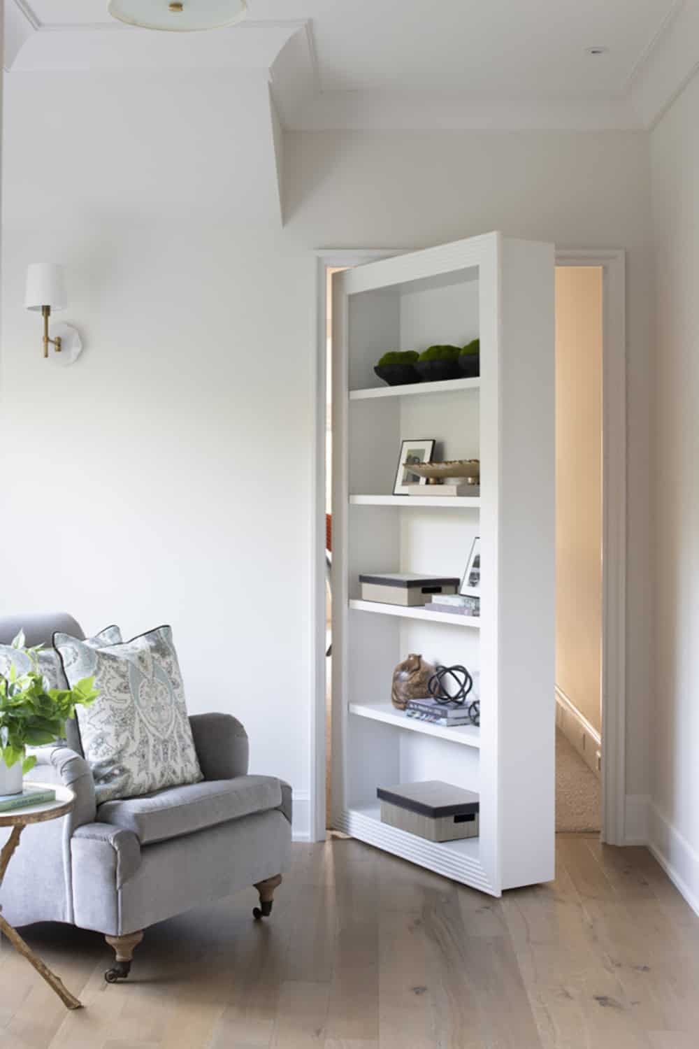 transitional style bedroom with a secret door