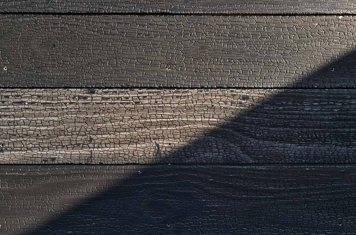 charred barn house exterior detail