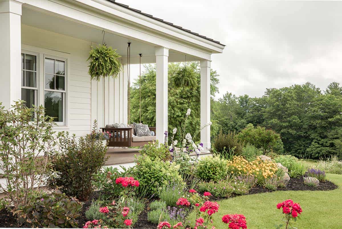 coastal farmhouse exterior front porch with a garden