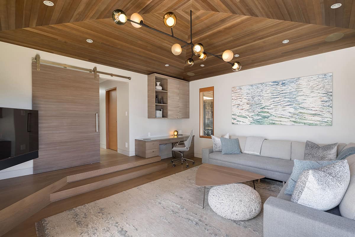 coastal modern family room with a sliding barn door