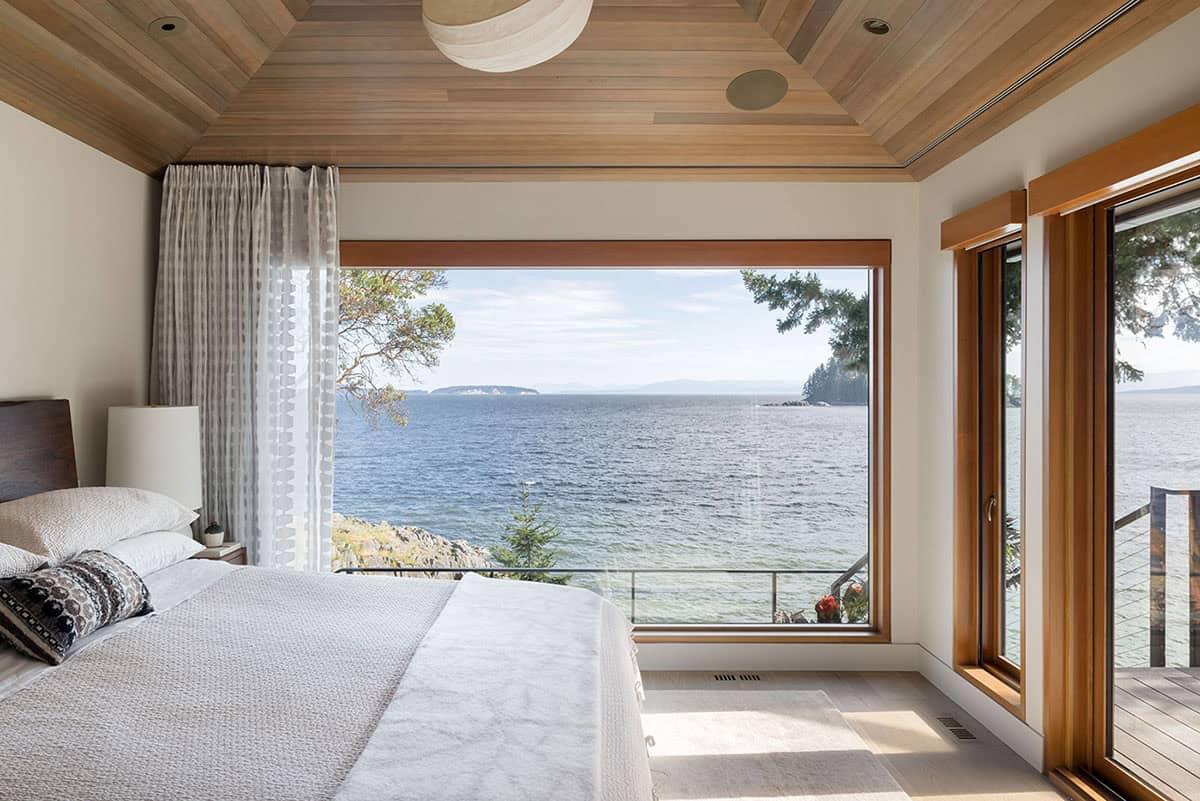 coastal modern bedroom with a large window