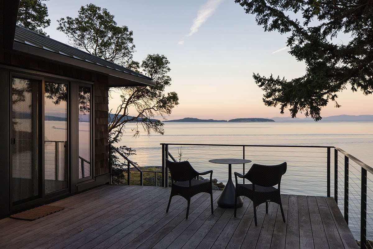 coastal modern home exterior patio with outdoor furniture