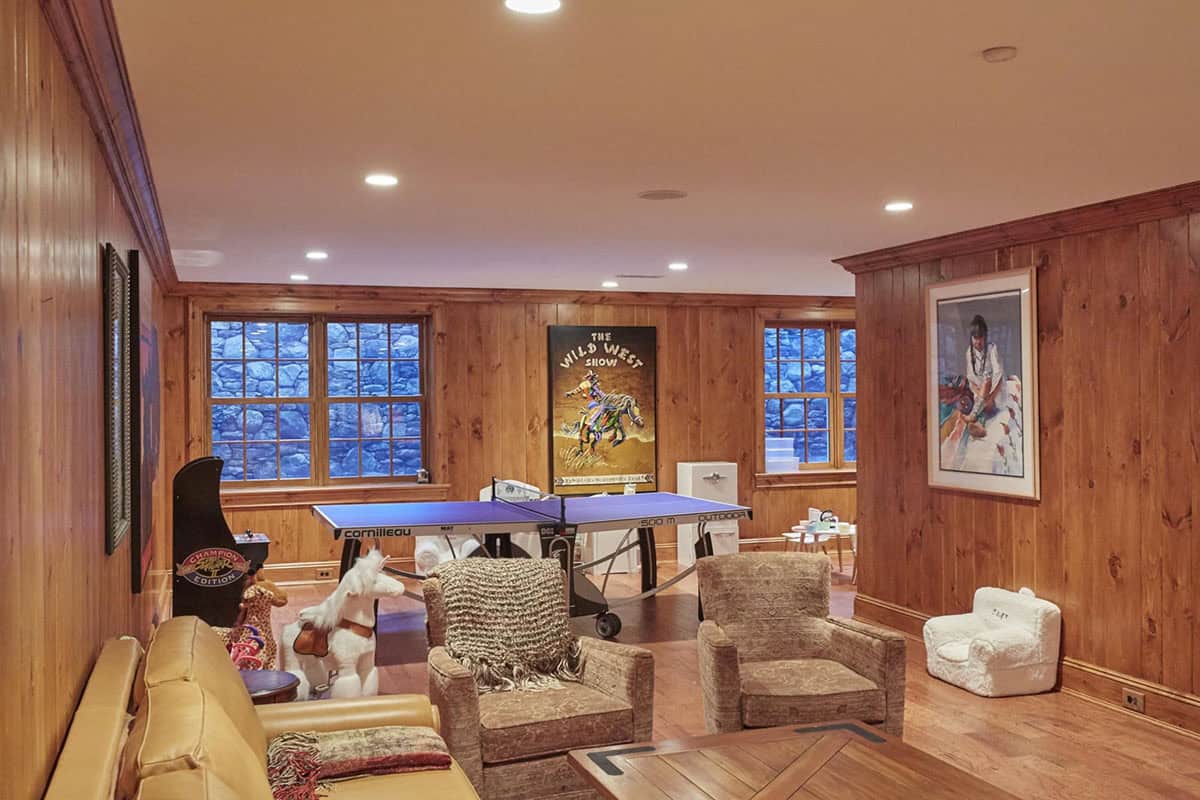 rustic family room with a ping pong table