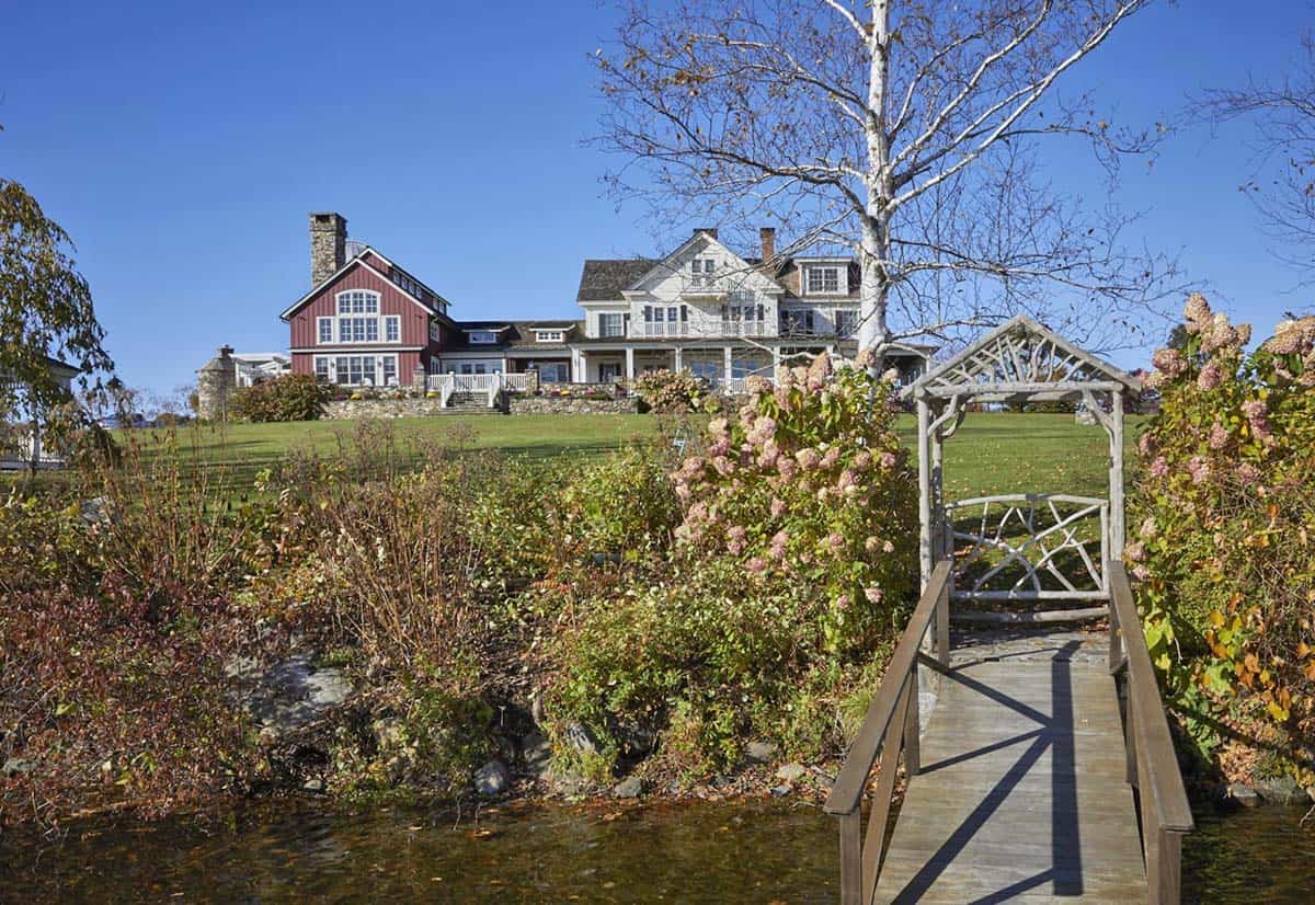 waterfront farmhouse with a boat dock