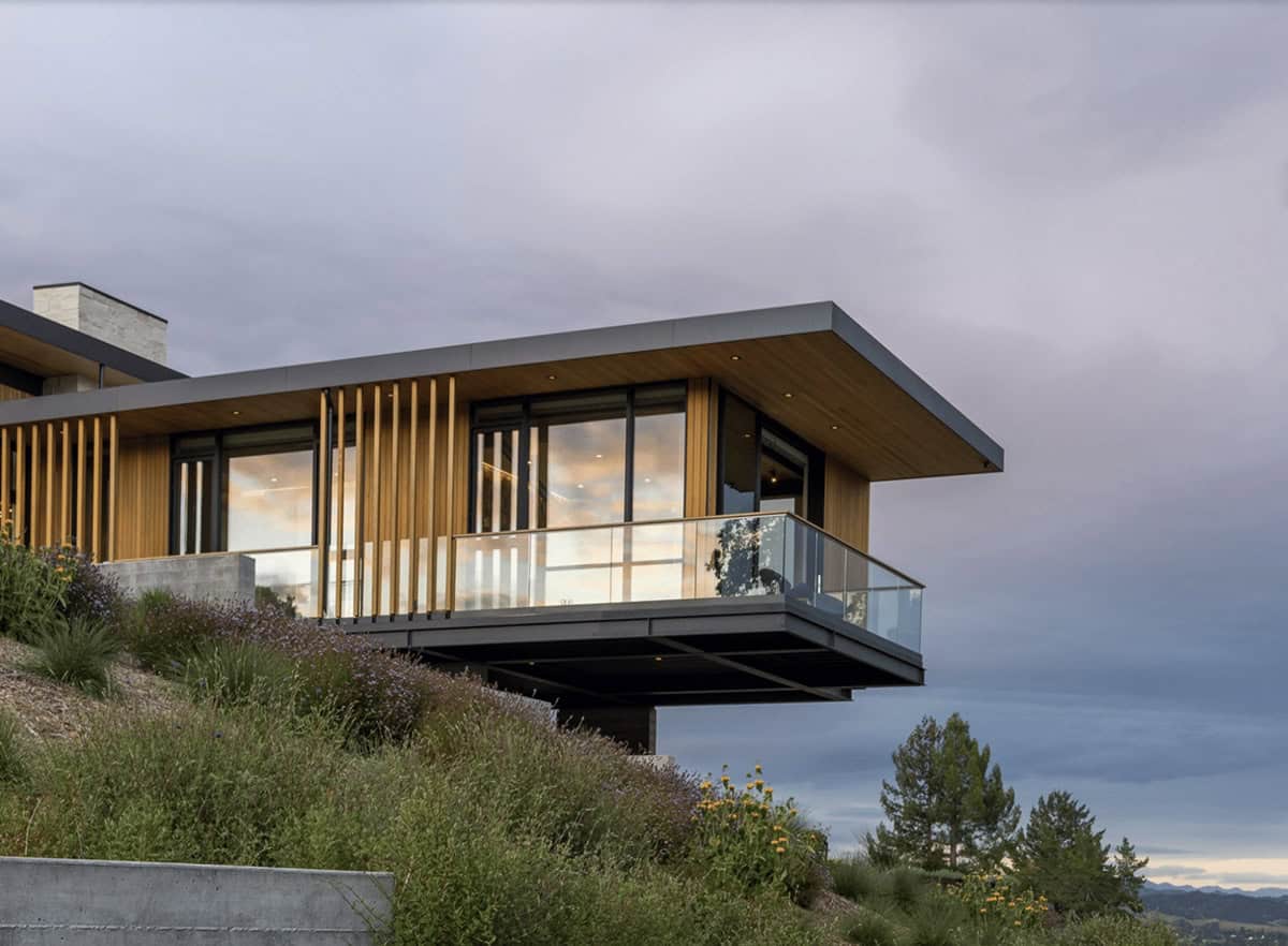 contemporary home exterior cantilevered over a hillside