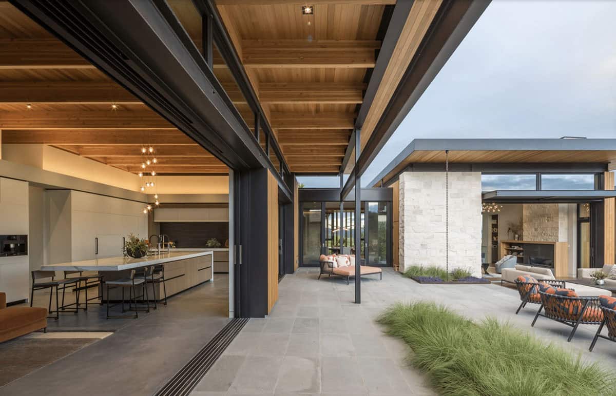 contemporary home kitchen with sliding glass doors connecting to the patio
