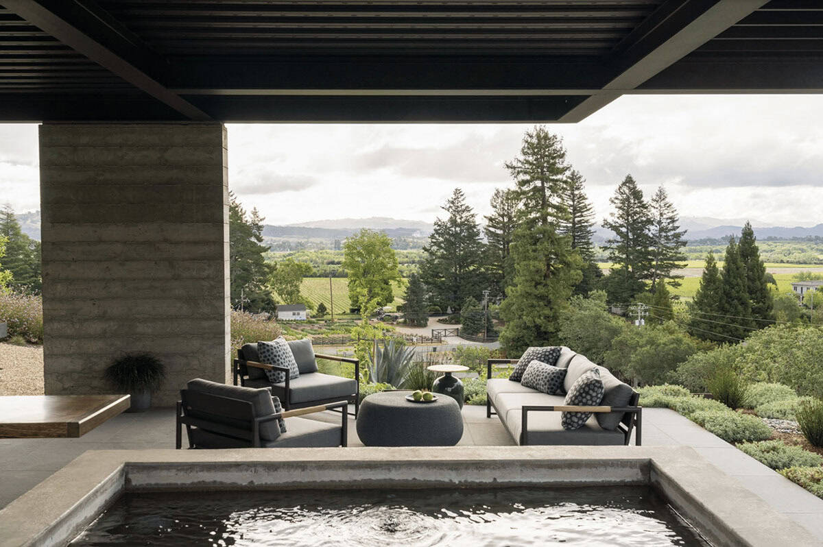 contemporary covered patio with a hot tub