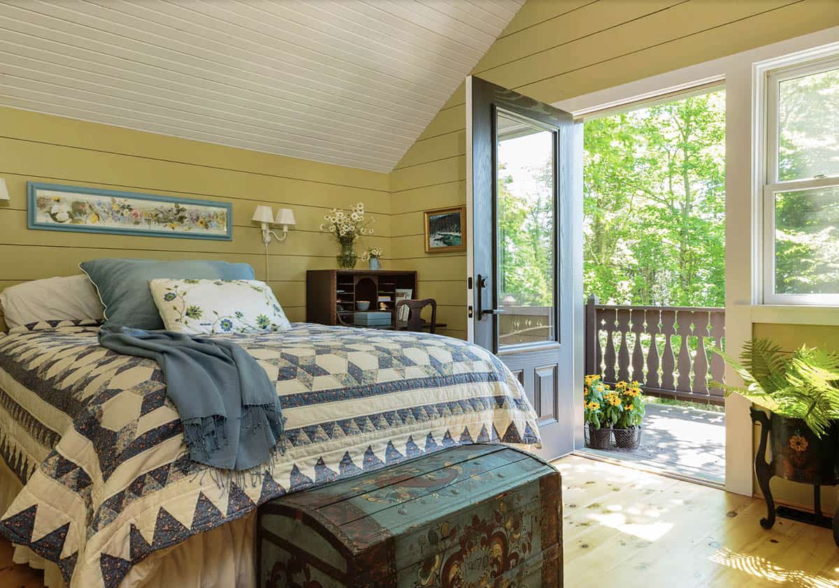 scandinavian-inspired bedroom with a private balcony