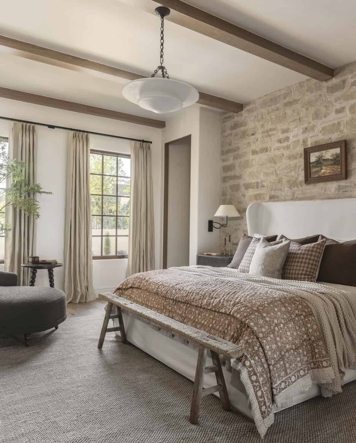 organic modern bedroom with a stone wall