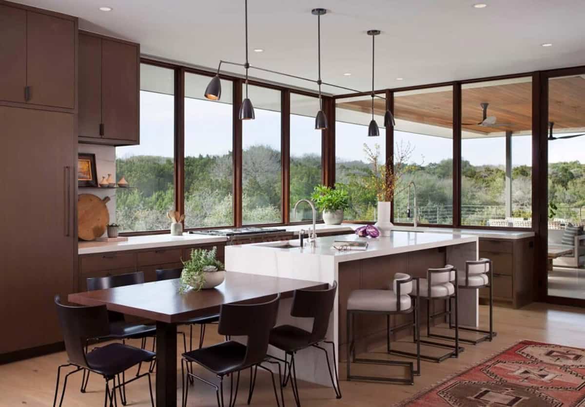 contemporary kitchen with a built-in island dining table