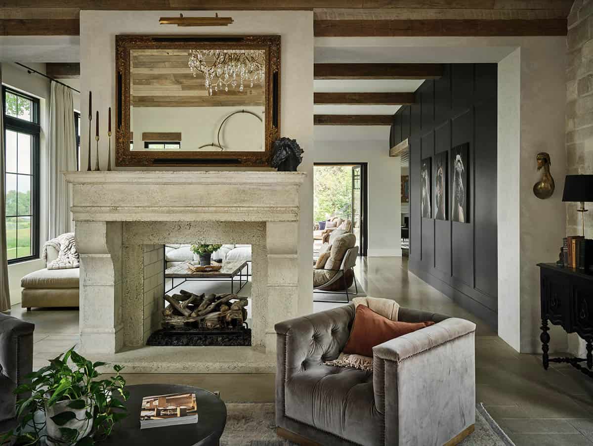 french country living room with a dual-sided fireplace