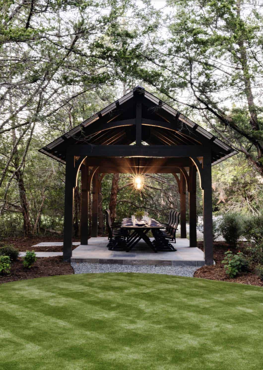 French Country Patio with a trellis and outdoor dining