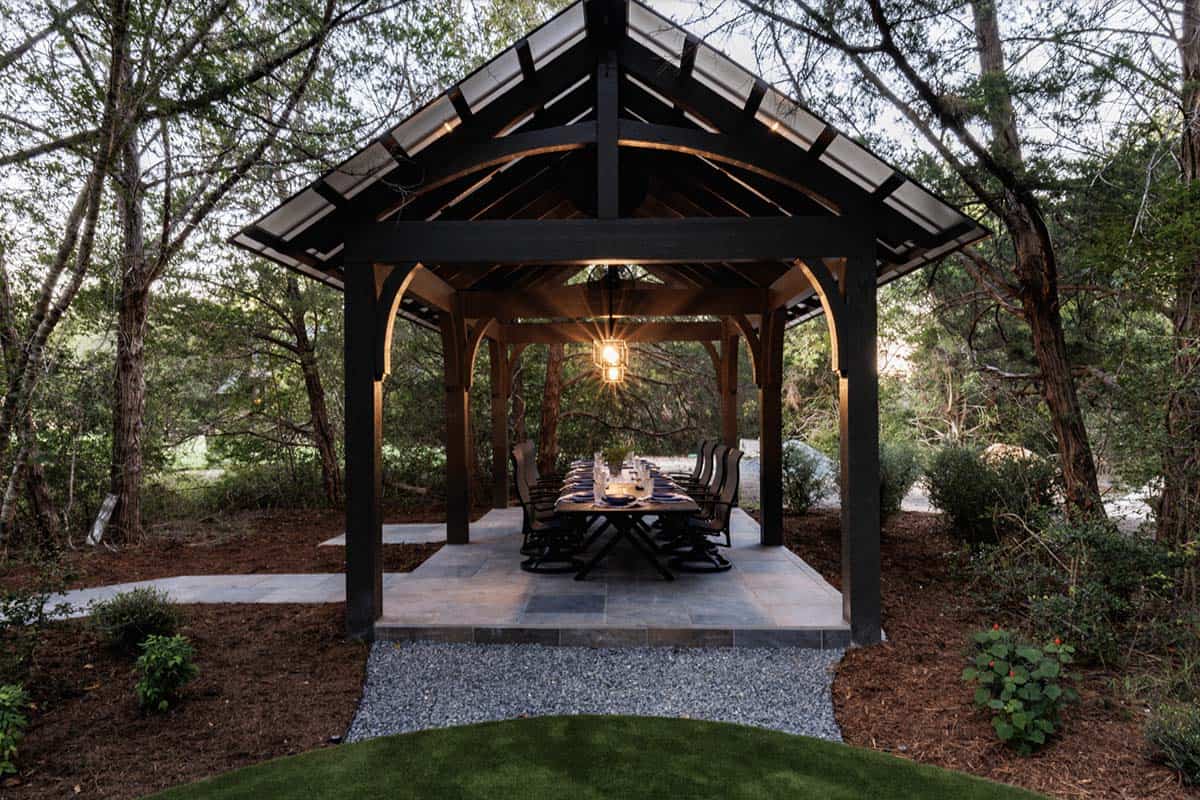 French Country Patio with a trellis and outdoor dining