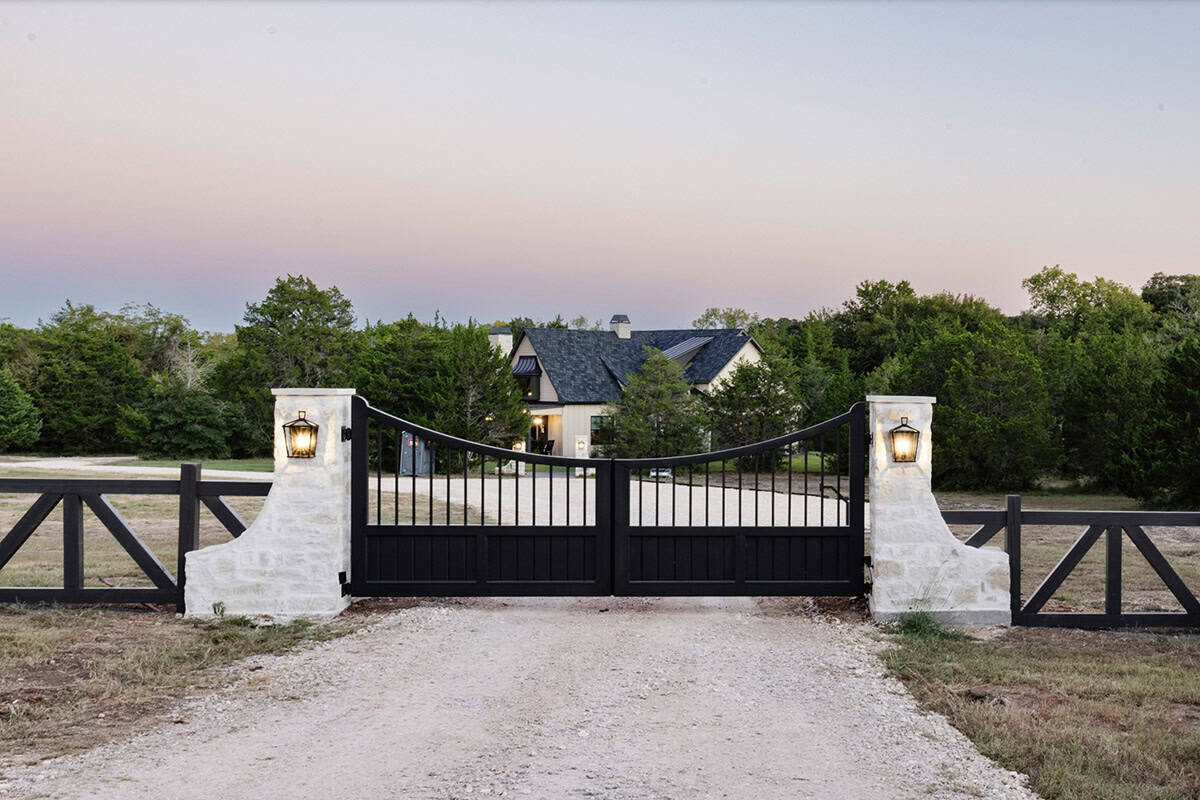 French Country Home Exterior with a gate