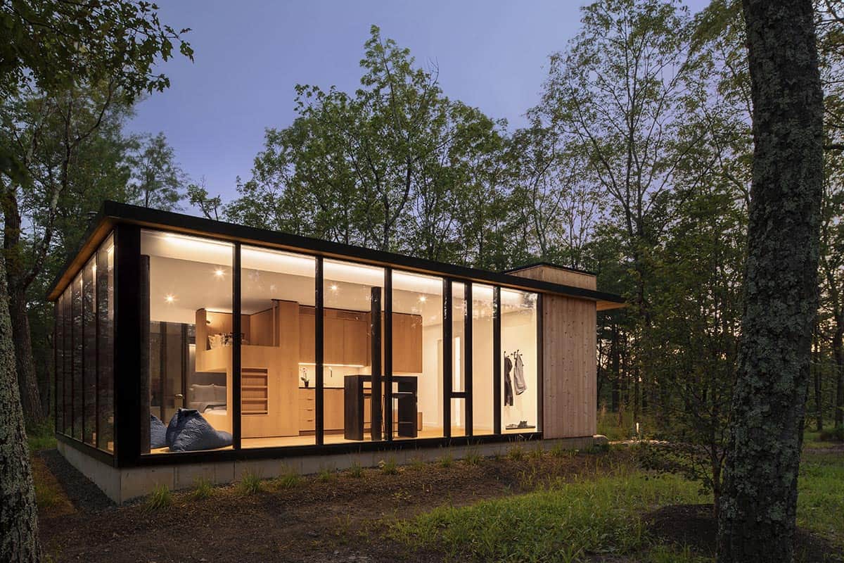 glass bunkhouse exterior at dusk