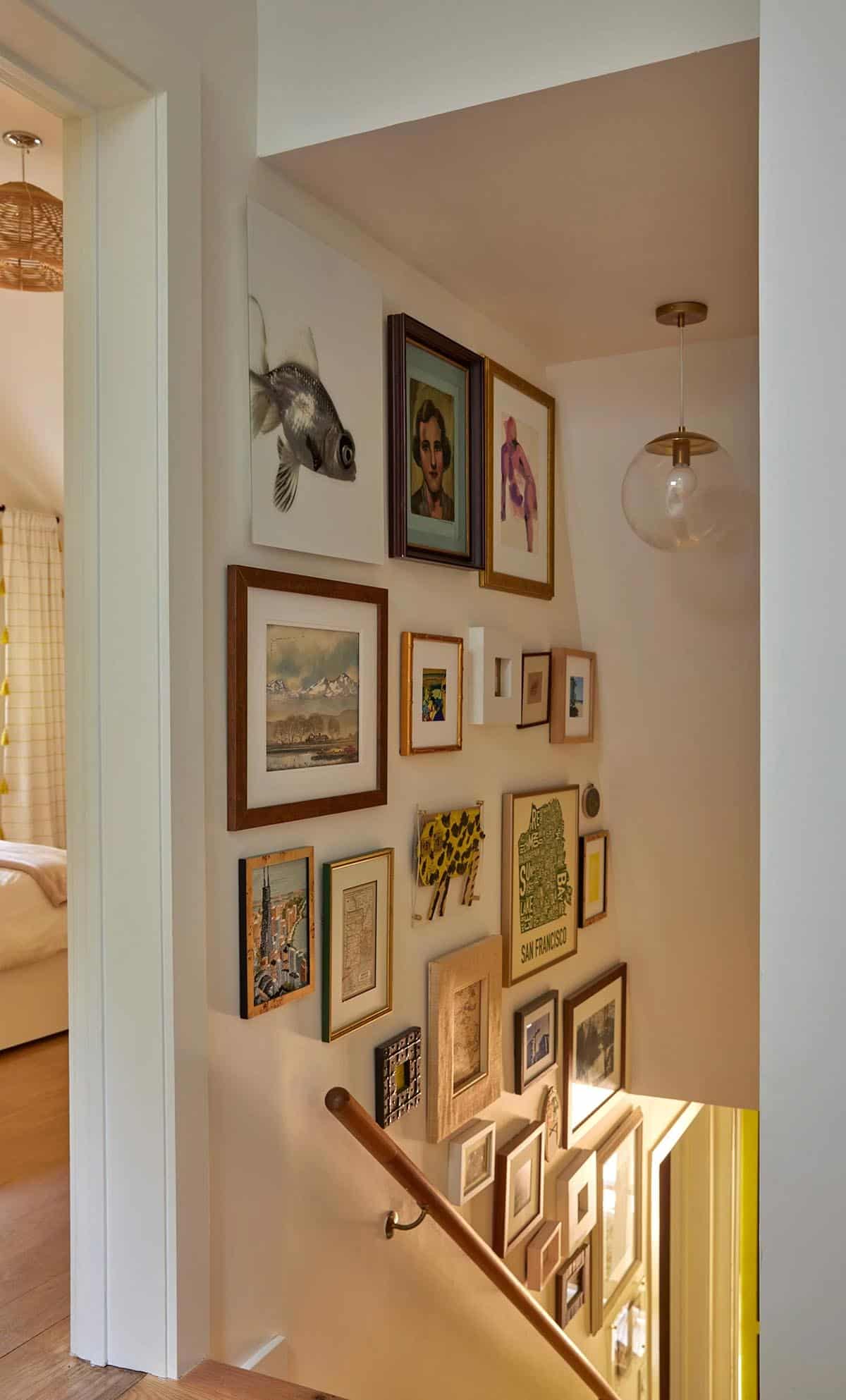 Traditional Staircase with an art gallery wall
