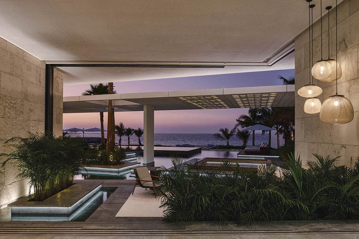 A luxury home featuring elegant decor and a stunning view of the ocean through large windows