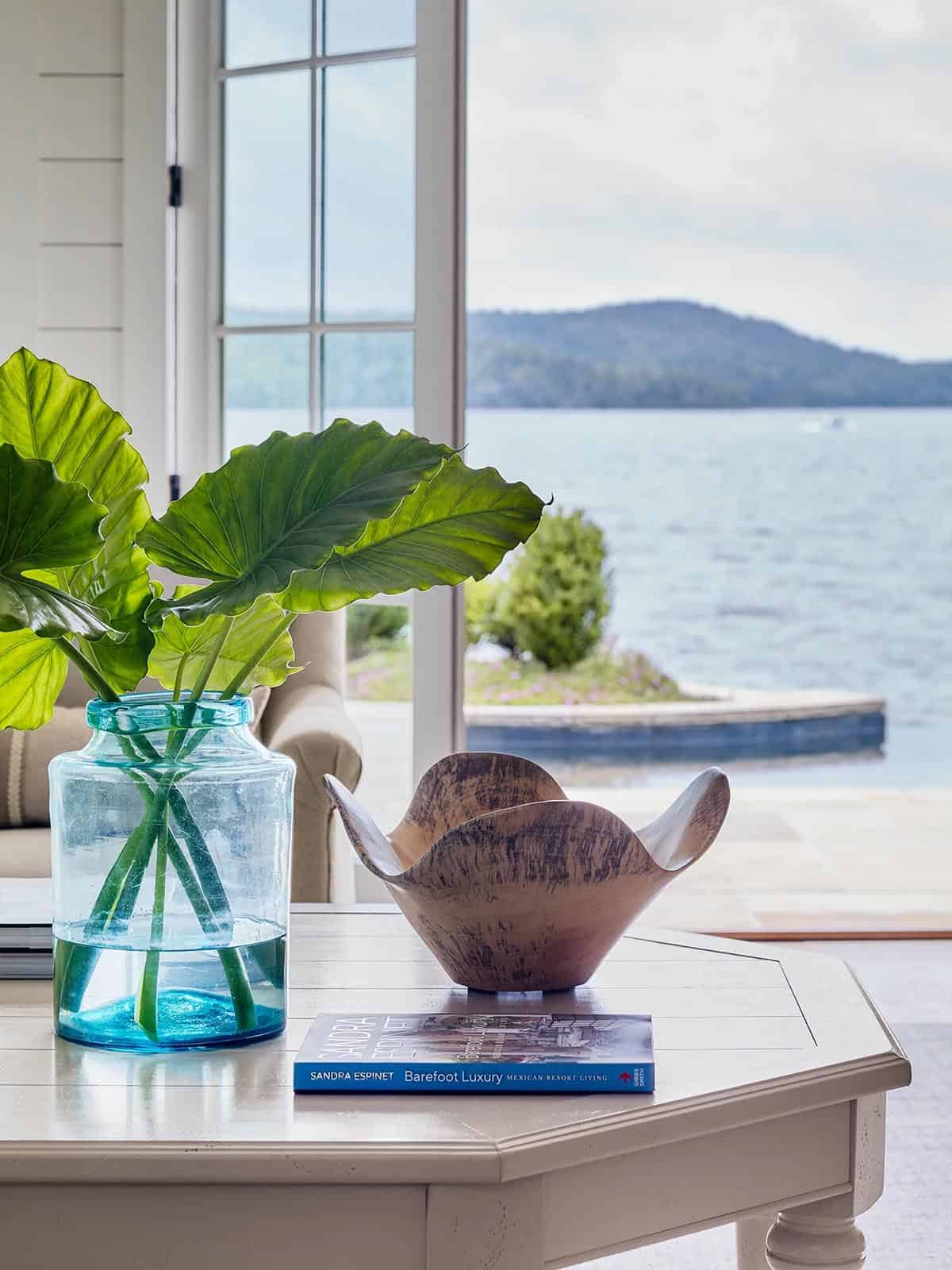 contemporary covered patio with outdoor furniture overlooking the lake