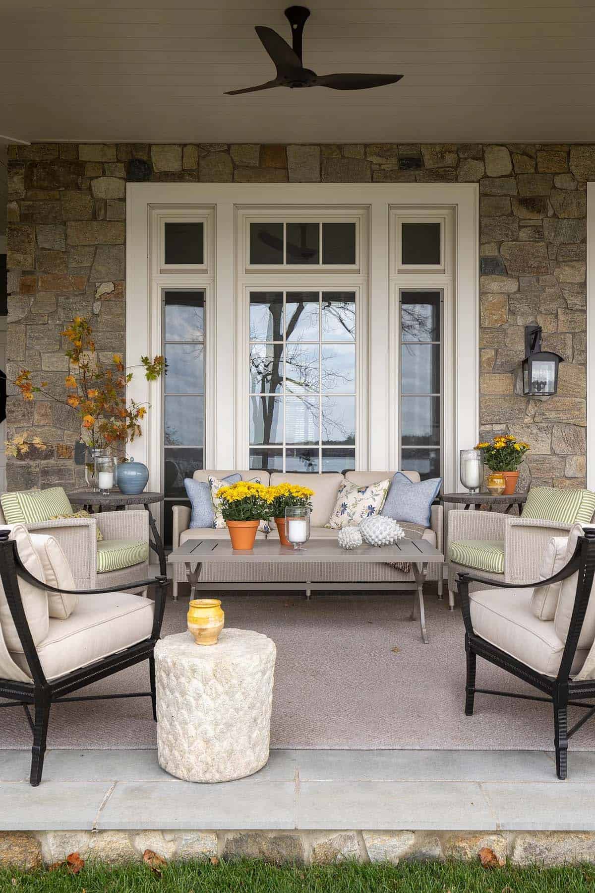Lakeside cottage porch with comfortable seating and charming decor. Perfect outdoor space for relaxi.