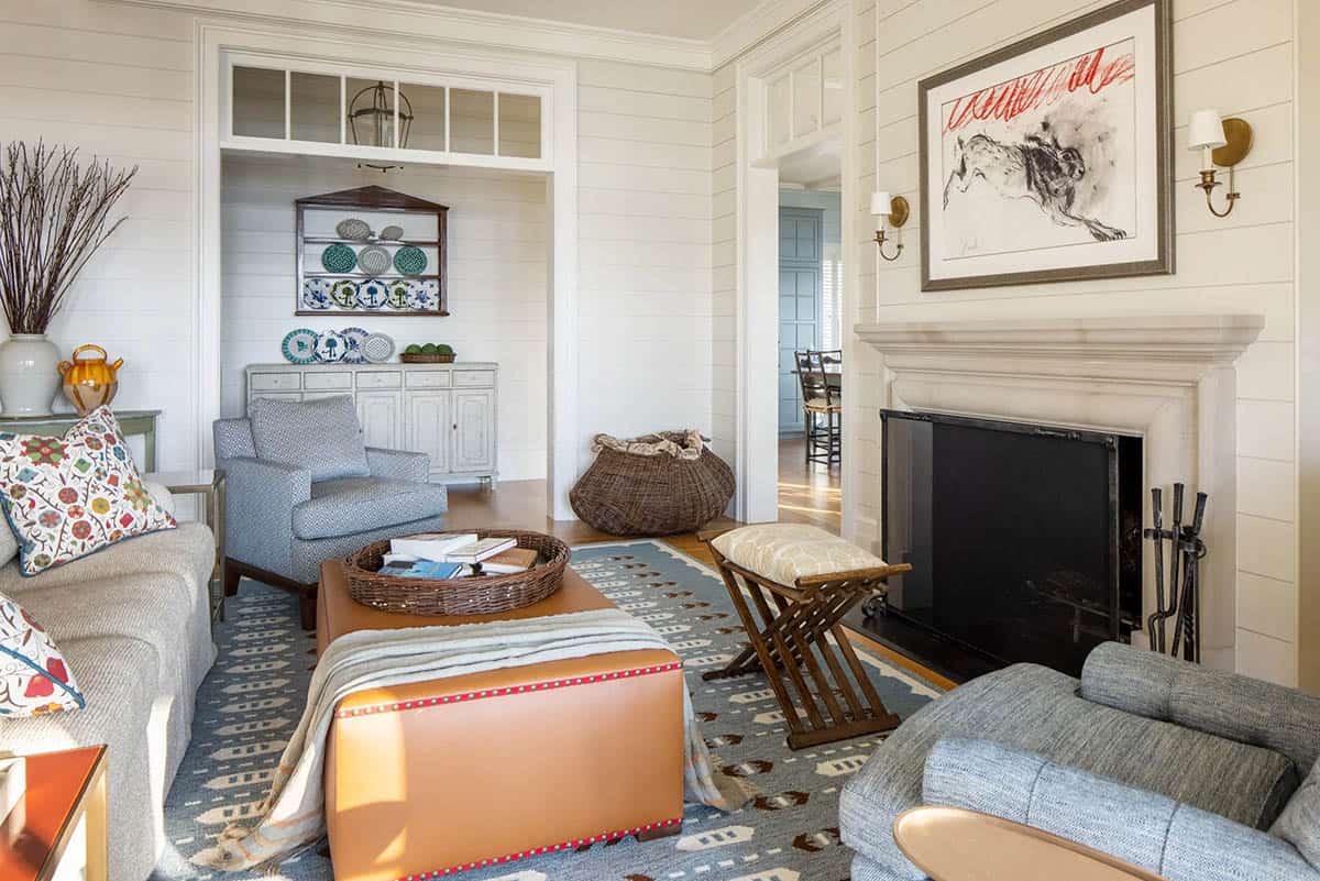 modern coastal style living room with a fireplace