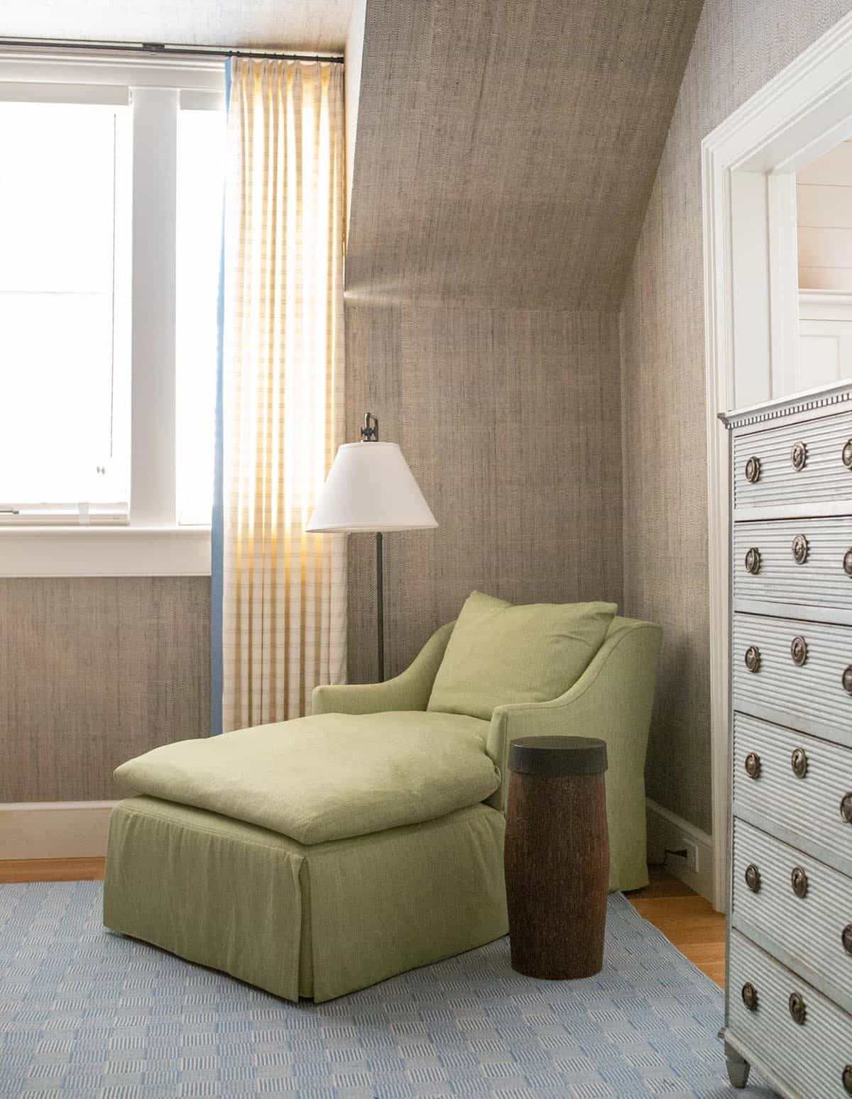 modern coastal style bedroom with a chaise lounge